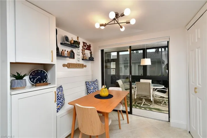 Notice built in bench in breakfast nook across from pantry