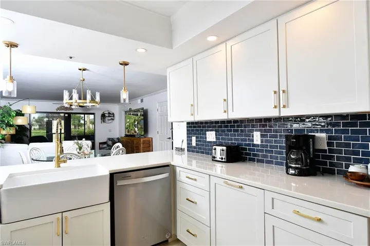 Overlooking dining and living areas, through to back lanai with golf, water, and sunset views!