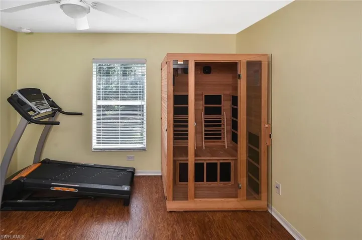...and the Den, currently set up as a fitness room.  Check out the personal SAUNA and treadmill!  Yes, they are INCLUDED!