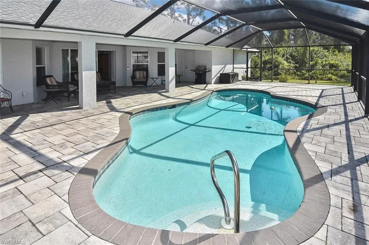 ...with a large freeform pool installed by Artesian...