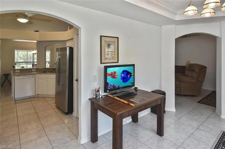 This front room, right off the kitchen, is currently set up as an office...