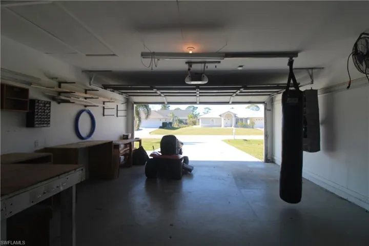 Garage featuring a garage door opener
