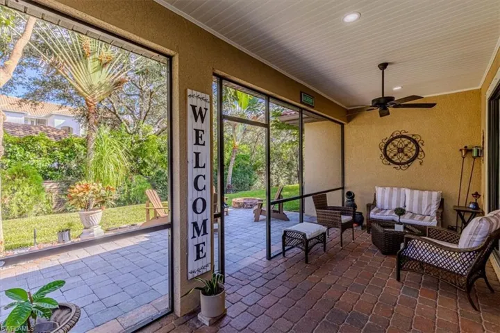 View of patio / terrace with a sunroom, outdoor lounge area, and a ceiling fan