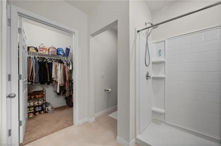 Master bedroom with walk in closet and water closet