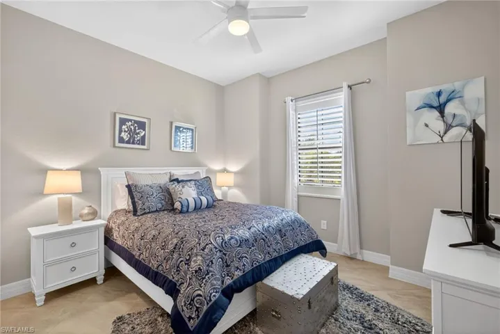Bedroom with baseboards and ceiling fan