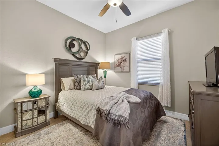 Bedroom featuring light wood-style flooring and ceiling fan