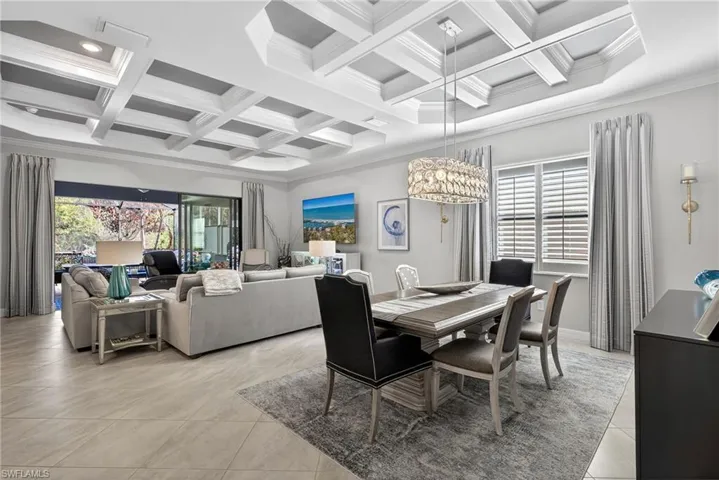 Dining room with coffered ceiling and crown molding