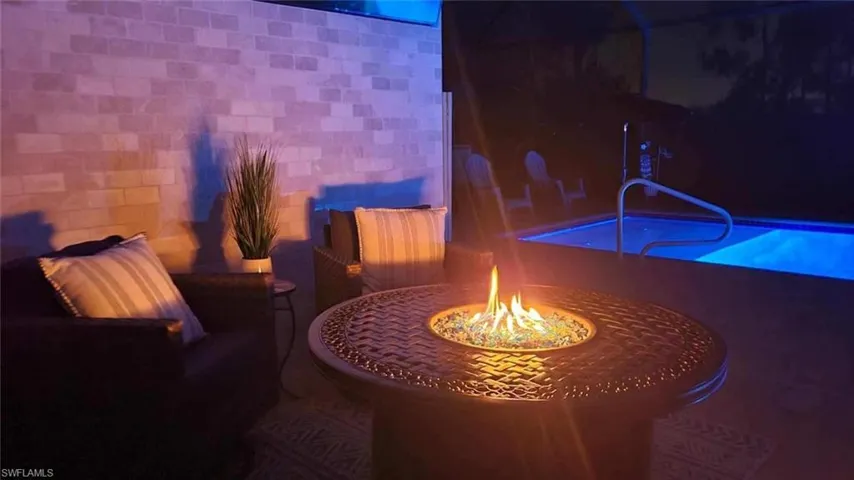 Custom lighting highlights the custom stonework in your private lanai setting.