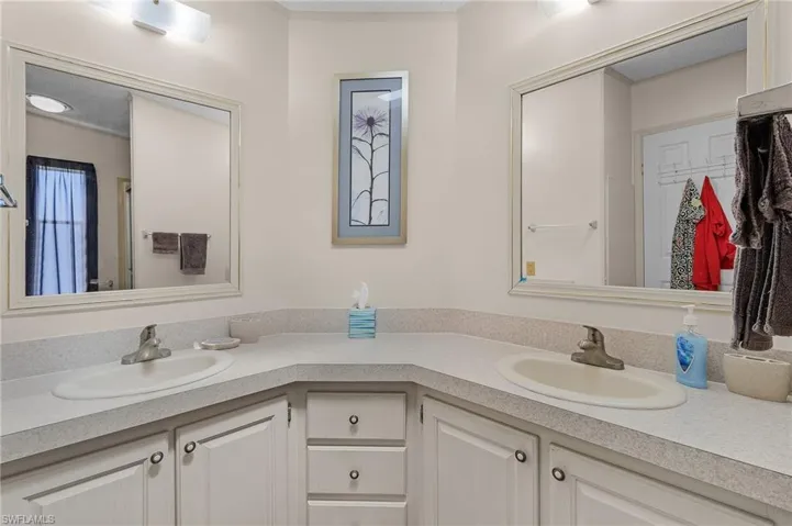 Bathroom featuring double vanity and a sink