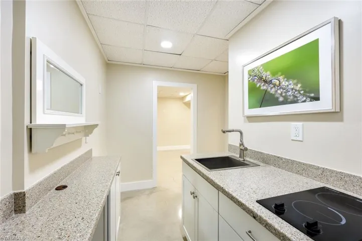 Additional kitchen on the lower level is PERFECT for guests OR a snack before heading out on your boat....