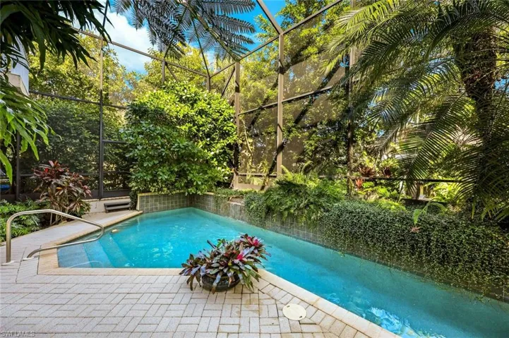 Relax in the fully screened riverside lanai area.
