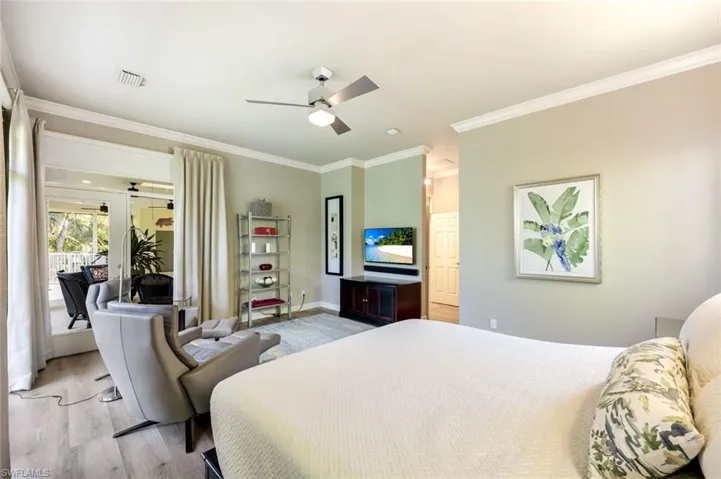 Primary suite offers access to the lanai and gorgeous views.