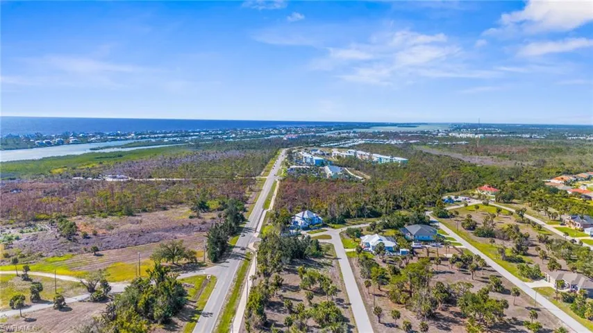Aerial view of residential area with a nearby body of water