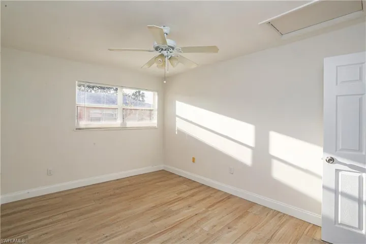 Empty room featuring ceiling fan and light hardwood / wood-style flooring