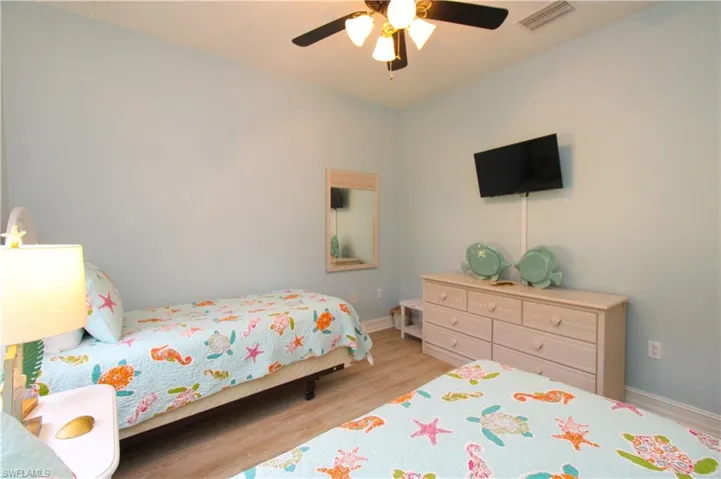 Bedroom featuring light hardwood / wood-style flooring and ceiling fan