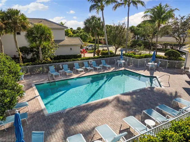 Community pool with a patio area