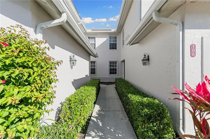 Doorway to property with stucco siding