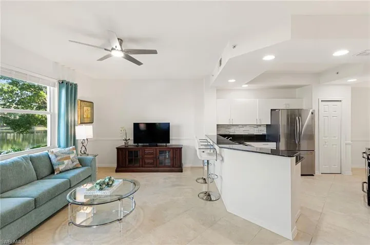 Living room featuring recessed lighting and ceiling fan