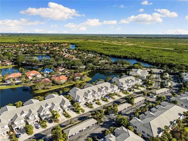 Aerial perspective of suburban area featuring a large body of water