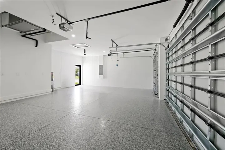 Garage featuring a garage door opener