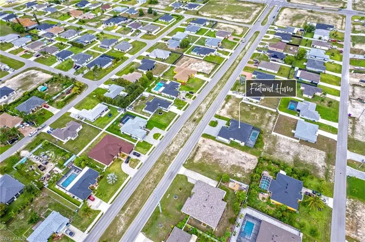 Aerial overview of property's location with nearby suburban area