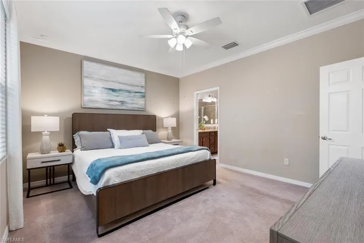 Master bedroom featuring ensuite bath