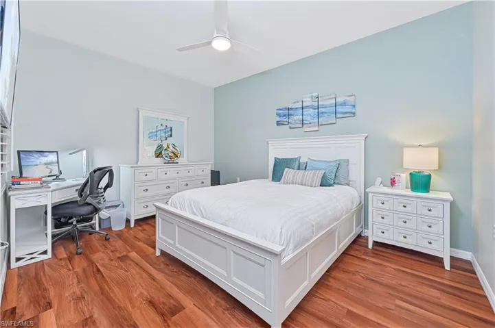 Bedroom with ceiling fan and wood-type flooring