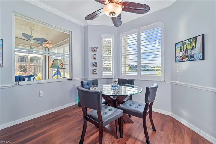 Dining room featuring hardwood / wood-style flooring and crown molding