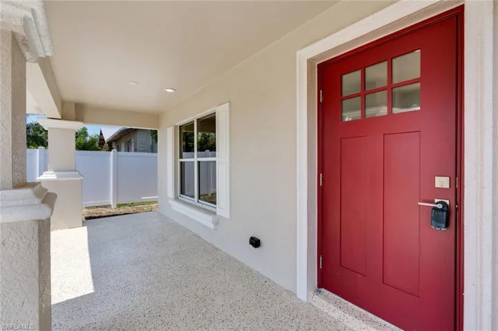 Property entrance with stucco siding