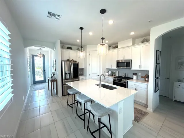 Upgrades: Extended height cabinets with crown molding & hardware,  counters, tile backsplash, undermount one bowl sink, faucet, tile flooring,  additional outlets!