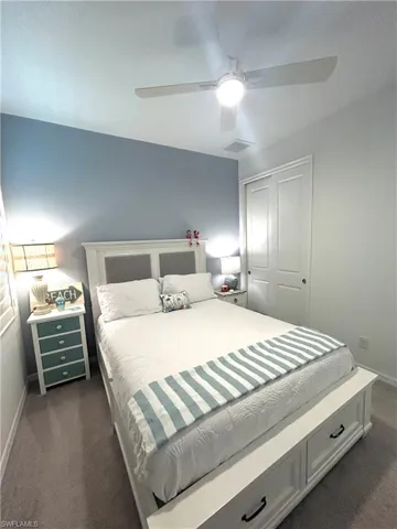 Secondary bedroom with ceiling fan & upgraded carpet