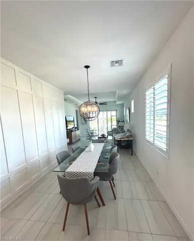 Professionally installed board & batten wall, Upgrades include tile, chandelier & plantation shutters