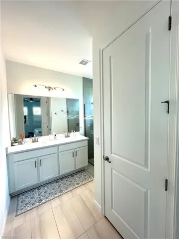 Upgrades include double sink vanity, faucets & tile