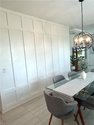 Professionally installed board & batten wall, Upgrades: tile, chandelier & plantation shutters