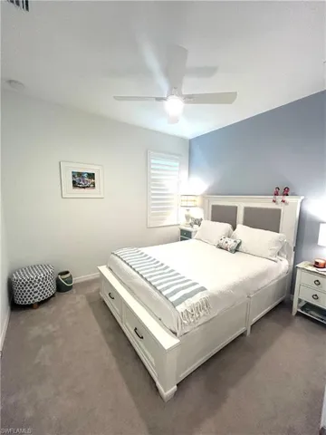 Secondary bedroom with ceiling fan & upgraded carpet