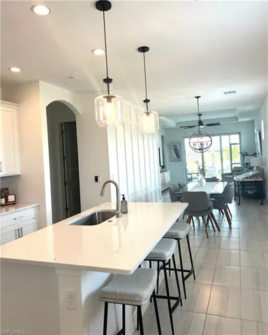 Upgrades: Extended height cabinets with crown molding & hardware,  counters, tile backsplash, undermount one bowl sink, faucet, tile flooring,  additional outlets!