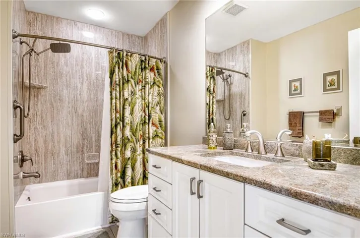 Bathroom with vanity and shower / bath combo
