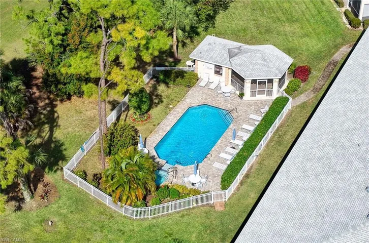 View of subject property with a pool