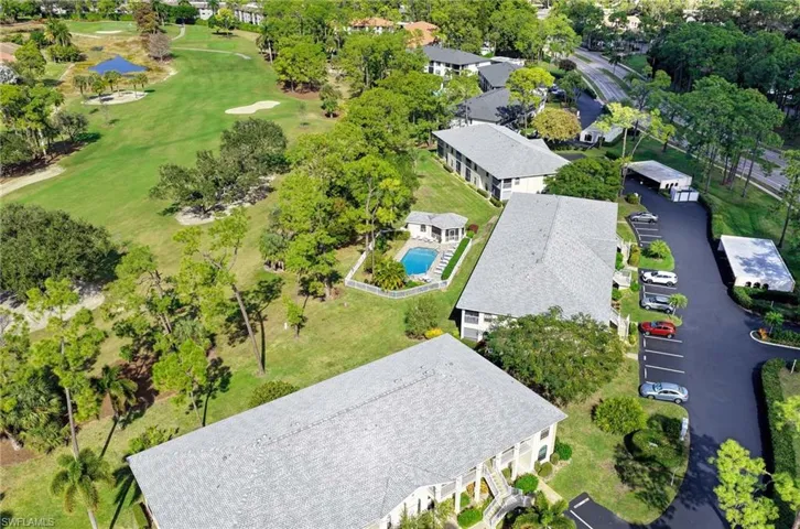 Aerial perspective of suburban area featuring a golf club