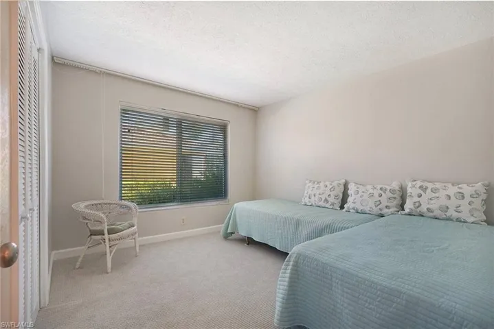 Guest Bdrm w/new Berber carpeting and contents that convey with sale