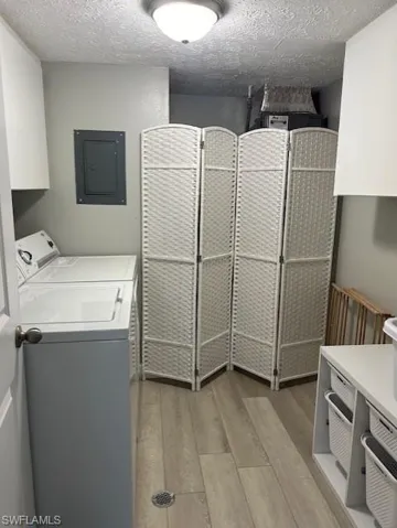 Oversized Laundry rm with ample cabinets, storage etc. Easy access to Air Handler, Water Heater & Electrical Panel