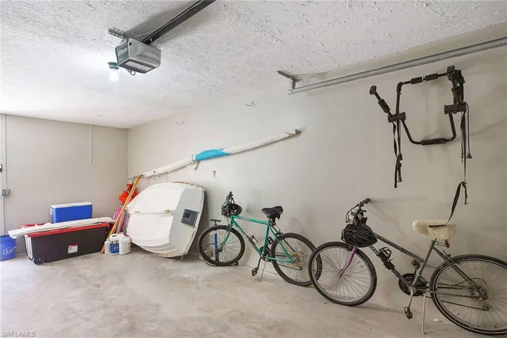 One Car Garage includes small sailboat, bikes, etc all convey with sale.