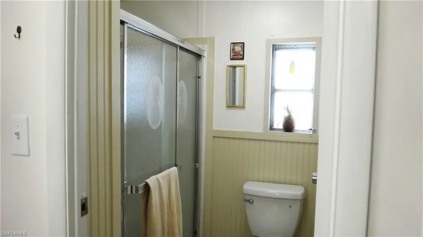 Primary Bathroom with a shower and toilet