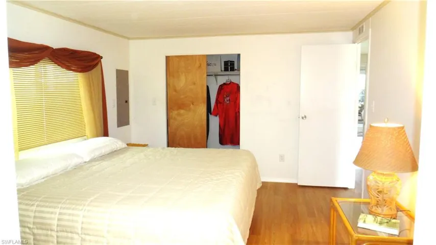 Bedroom  wood-style flooring, and large closet