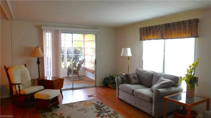 Living room with patio window view of Lake