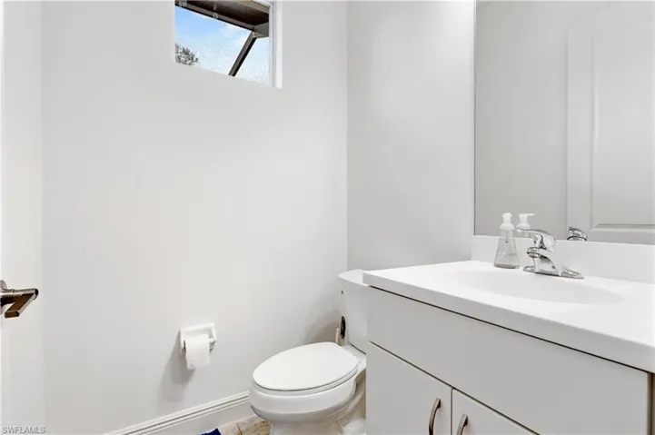 Pool Bathroom with vanity and toilet