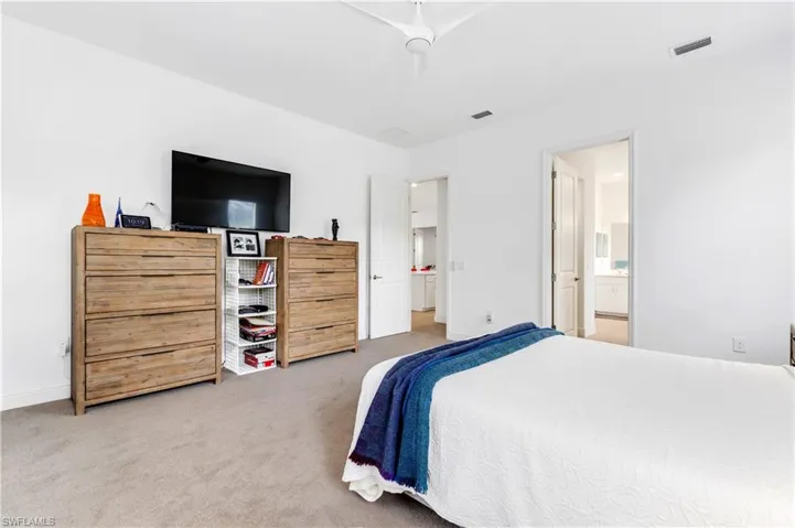 View of carpeted primary bedroom