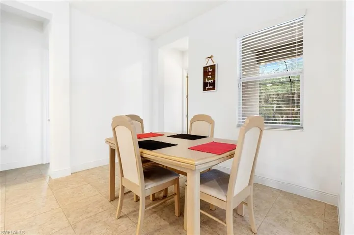 Dining room featuring baseboards and light tile patterned floors