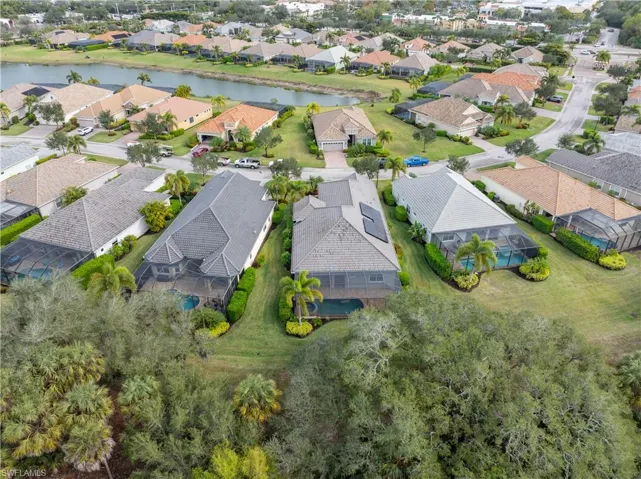 Aerial perspective of suburban area with a large body of water