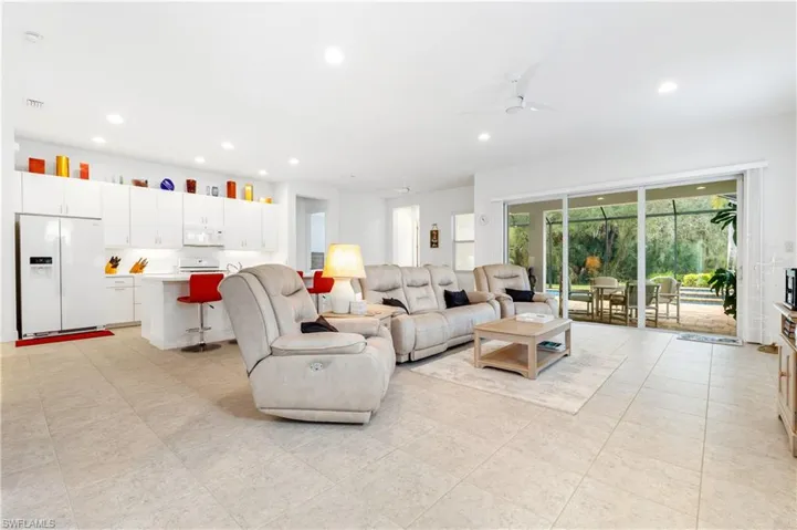 Living room featuring recessed lighting and ceiling fan